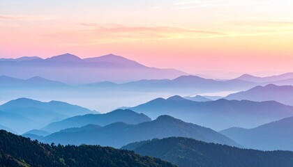 Fototapeta premium Misty mountain sunrise with layered peaks and soft pastel sky landscape photography