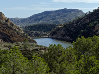 Reservoir lake in mountainous region with curious rock formations