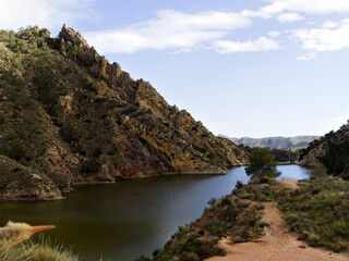 Reservoir lake in mountainous region with curious rock formations