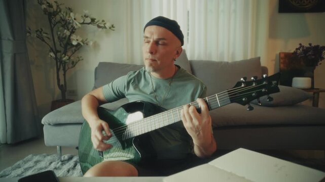 Man Adjusting Guitar Comfortably Indoors. Casual Musician Finetuning Strings In Relaxed Environment
