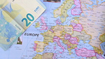 Obraz premium Euro Bill on Europe Map - Travel and Economy Concept