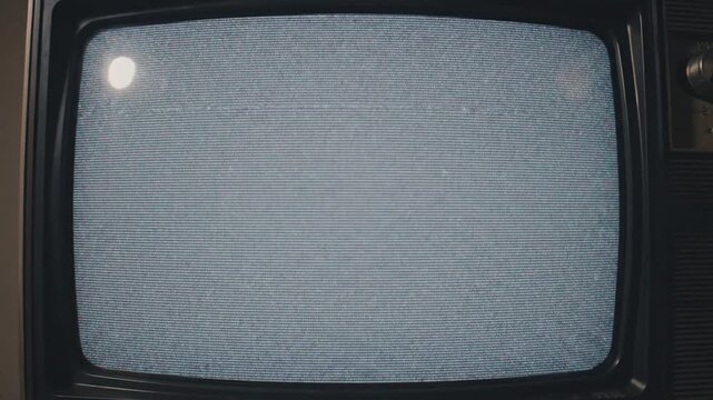 Vintage television screen displaying static noise and interference a classic analog broadcast signal disruption retro technology concept.