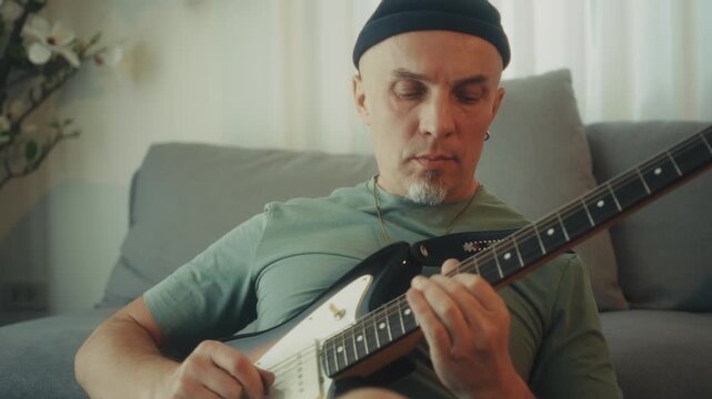 Closeup Of Guitar String Picking. Close Shot Of Fingers Pressing Guitar Frets With Concentration