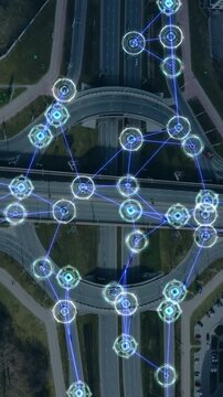 Aerial view of self-driving cars moving around the city. Traffic in a big city controlled by artificial intelligence. GPS control, self-driving car. Interaction of cars connected to a common network.