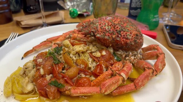 a delicious plate of spaghetti with spider crab and red and yellow cherry tomatoes from Vesuvius