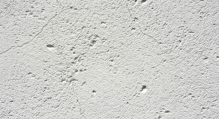 Obraz premium Gray textured surface with yellow stain.