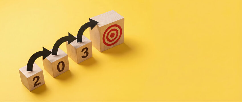 Conceptual business strategy for the year 2030 with wooden blocks and arrows pointing toward a target goal.