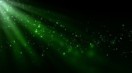 Obraz premium Green light rays illuminating glowing magical particles and glitter on a dark abstract background with copy space creating a shimmering effect