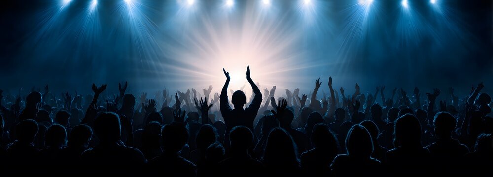 Concert Applause: A silhouette of a person at the center, arms raised in jubilation, amid a cheering crowd under bright stage lights, capturing the electric atmosphere of a live performance.