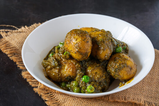 Sobuj Aloor Dum | Bengali Green Masala Potato Curry | Spiced Dum Aloo with Fresh Herb Gravy | Traditional Indian Vegetarian Potato Dish Served in Bowl