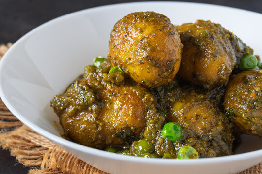 Sobuj Aloor Dum | Bengali Green Masala Potato Curry | Spiced Dum Aloo with Fresh Herb Gravy | Traditional Indian Vegetarian Potato Dish Served in Bowl