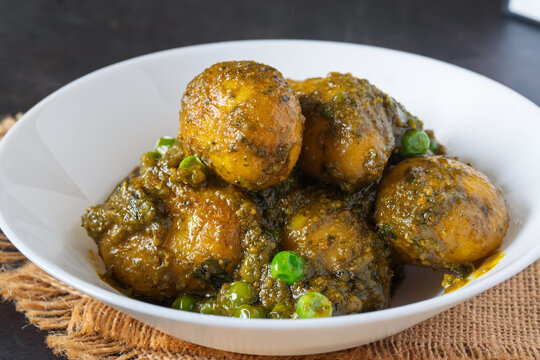 Sobuj Aloor Dum | Bengali Green Masala Potato Curry | Spiced Dum Aloo with Fresh Herb Gravy | Traditional Indian Vegetarian Potato Dish Served in Bowl