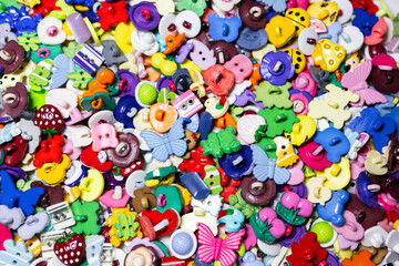 Naklejka premium a variety of children's plastic buttons for clothes in the form of animals
