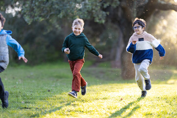 Happy boys running and playing in park © KONSTANTIN SHISHKIN