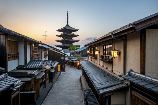 Yasaka dori historic street in the old town with traditional Japanese houses, five-story Yasaka Pagoda of the Buddhist Hōkanji Temple at the back, evening mood, sunset, Higashiyama, Kyoto, Japan