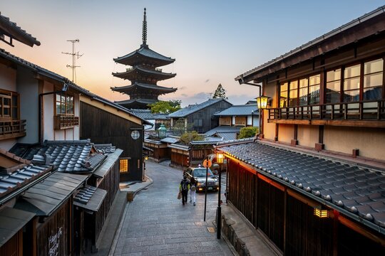 Yasaka dori historic street in the old town with traditional Japanese houses, five-story Yasaka Pagoda of the Buddhist Hōkanji Temple at the back, evening mood, blue hour, Higashiyama, Kyoto, Japan