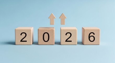 Wooden blocks showing year 2026 with rising arrows