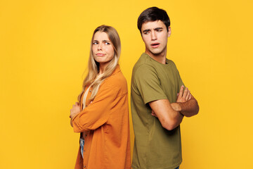 Side view young couple two friends family man woman they wear pink casual clothes together stand...