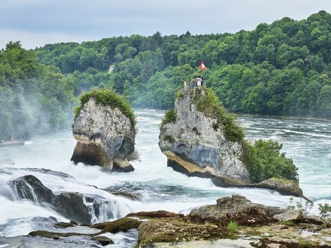 Rhine Falls, tourists standing on rocks, Canton Schaffhausen, Switzerland