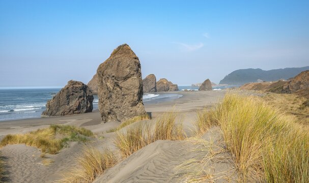 View over sandy beach with thins and large rocks, coastal landscape, Pistol River Middle, Ariyas Beach, Oregon, USA