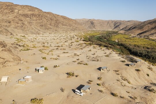 The Elephant Song campsite at the edge of a swampy stretch of the Hoanib river, aerial view, drone shot, Damaraland, Kunene Region, Namibia