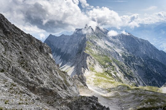 View from the via ferrata to Lamsenspitze, on exposed rocky ridge of Vomper Kette with summit of Hochnissl, Karwendel Mountains, Alpenpark Karwendel, Tyrol, Austria