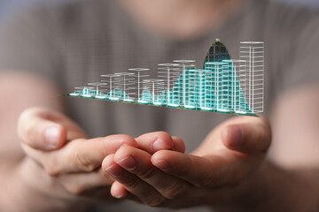 Innovative concept visualizing digital growth with hands holding a glowing futuristic chart...