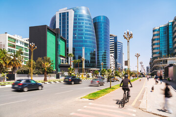 Vibrant Addis Ababa's skyline with sleek glass towers and ornate golden streetlights