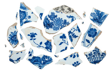 Broken ceramic fragments with blue and white floral patterns, representing antique heritage and fragility on transparent background