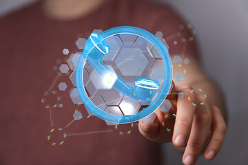 Abstract image of a glowing digital telephone handset held by a person's hand. Illustrating...