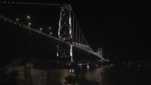 Florianopolis, night view of the Herc&iacute;lio Luz suspension bridge with the Santana fort in the foreground.