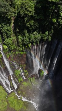 Aerial Wide View of Tumpak Sewu Waterfall Surrounded by Jungle, Indonesia 4K