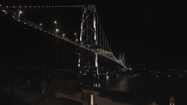Florianopolis, night view of the Herc&iacute;lio Luz suspension bridge with the Santana fort in the foreground.
