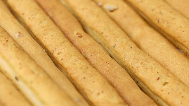 Traditional Italian breadsticks grissini circle rotation close up