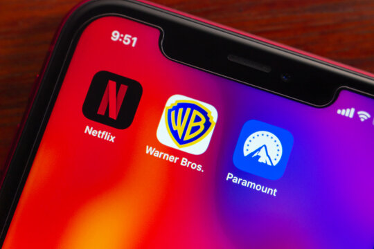 Quito, ECUADOR - Mar 2 2026 : Close up of smartphone home screen showing Netflix, Warner Bros and Paramount icons, highlighting streaming entertainment, media brands, subscriptions today.