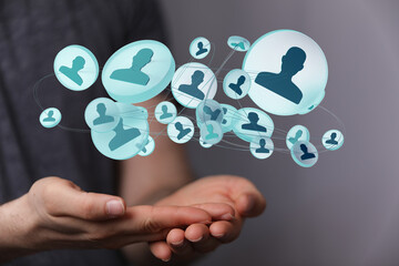 Fototapeta premium Person holding a digital network of people. Communication and business connection concept. Networking social media conne