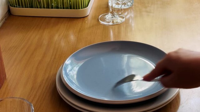 the fork scratches the empty plate