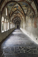 Obraz premium Historic cloister corridor with frescoed vaulted arches in Bressanone, Italy