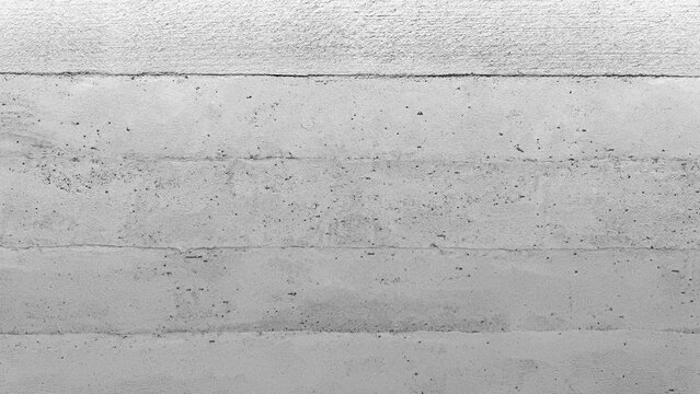 Minimalist light gray concrete wall texture with horizontal formwork lines. Industrial cement surface background for architectural design. Clean off-white plaster stone backdrop for modern loft style.