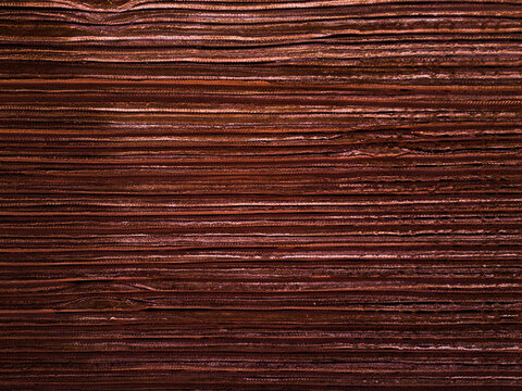Aerial view of rich, dark, textured wood grain patterns creating a captivating visual rhythm, Aluminium Refinery, Western Australia, Australia.