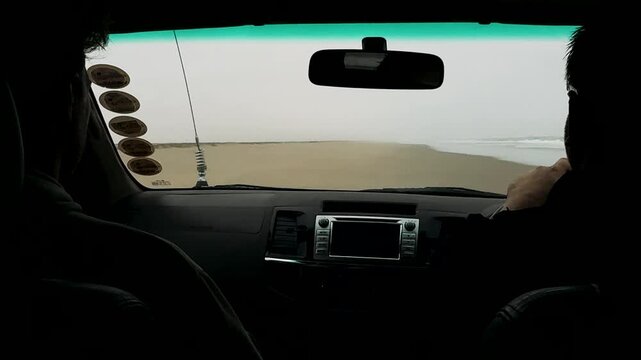 Sandwich Harbour in Namibia at the coast of the Atlantic Ocean. Sandy beach. Sandwich Harbor roundtrip daytime car tour