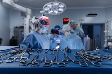 Team of surgeons focused on patient operation in fully equipped operating theater. Surgery concept.
