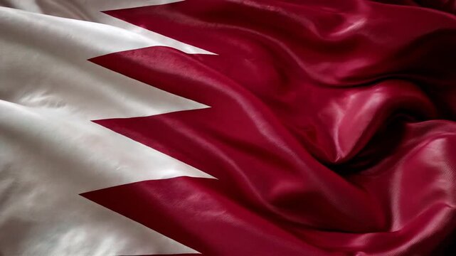 qatari flag waving in the wind. flag of qatar
