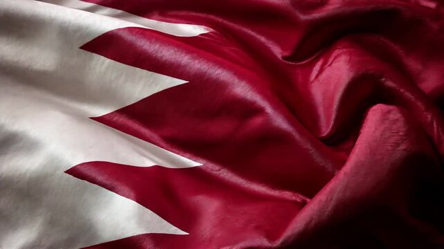qatari flag waving in the wind. flag of qatar