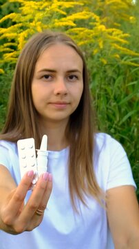 A woman is allergic to ragweed. Selective focus.