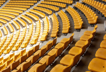 Rows of empty yellow stadium seats