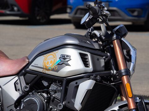 CFMOTO 700CL-X Heritage scrambler motorcycle, side view in the foreground. Milan - Italy,28 February 2026