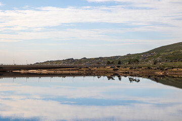 Obraz premium Mountain reservoir landscape with surrounding rocky hills in Serra da Estrela near Covilha, Portugal, Covilha, 16 October 2025