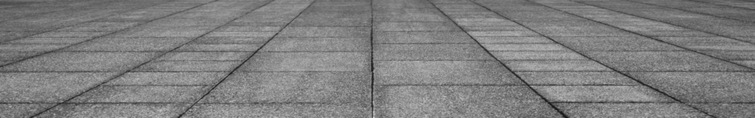 Fototapeta premium empty stone floor top in perspective. grey tile floor background in perspective view. line. empty copy space stone street. pavement. Granite outdoor tiled floor. gray granite. Marble texture