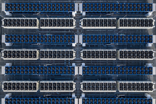 Aerial view of rows of containers housing computer components, a dense network of technology casting geometric shadows, Frankfurt am Main, Hessen, Germany.